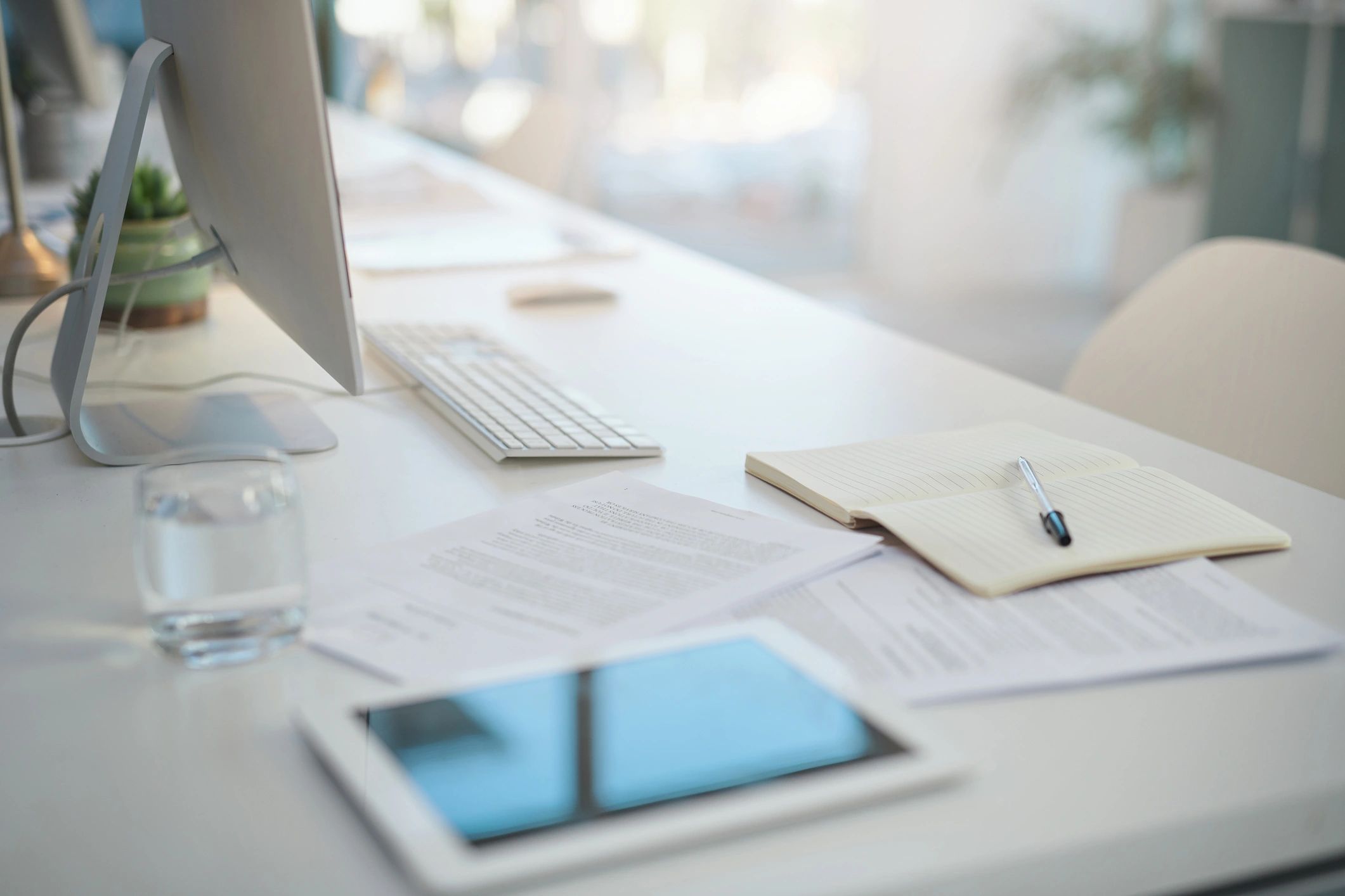 Modern desk with research materials and office items