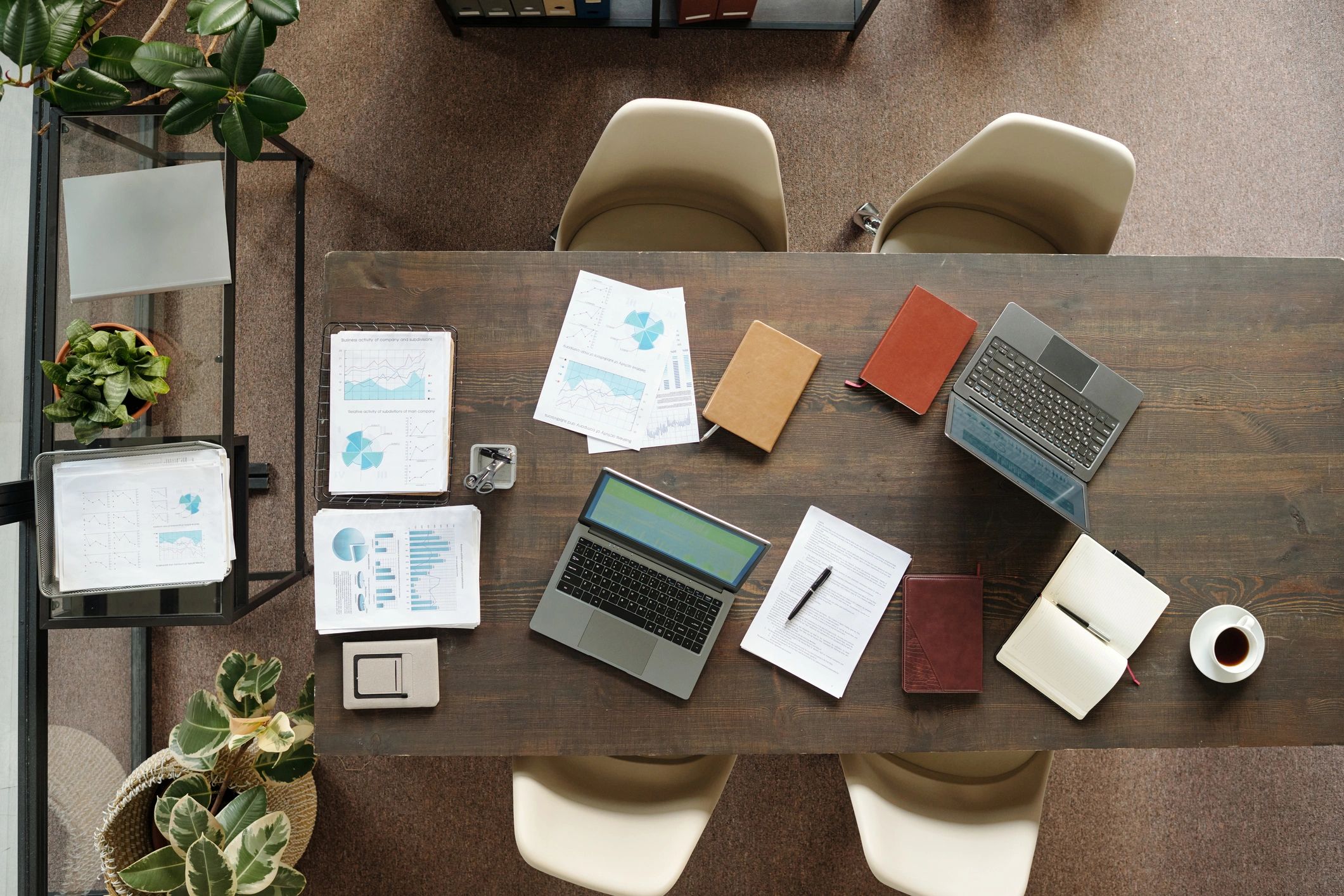 Workspace with laptops and printed documents used for policy research
